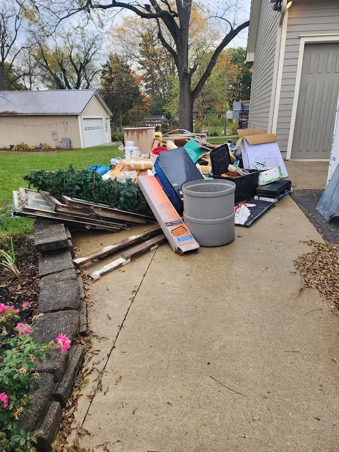 Dumpster being loaded with debris for 10 Yard Dumpster Rental in Lantana